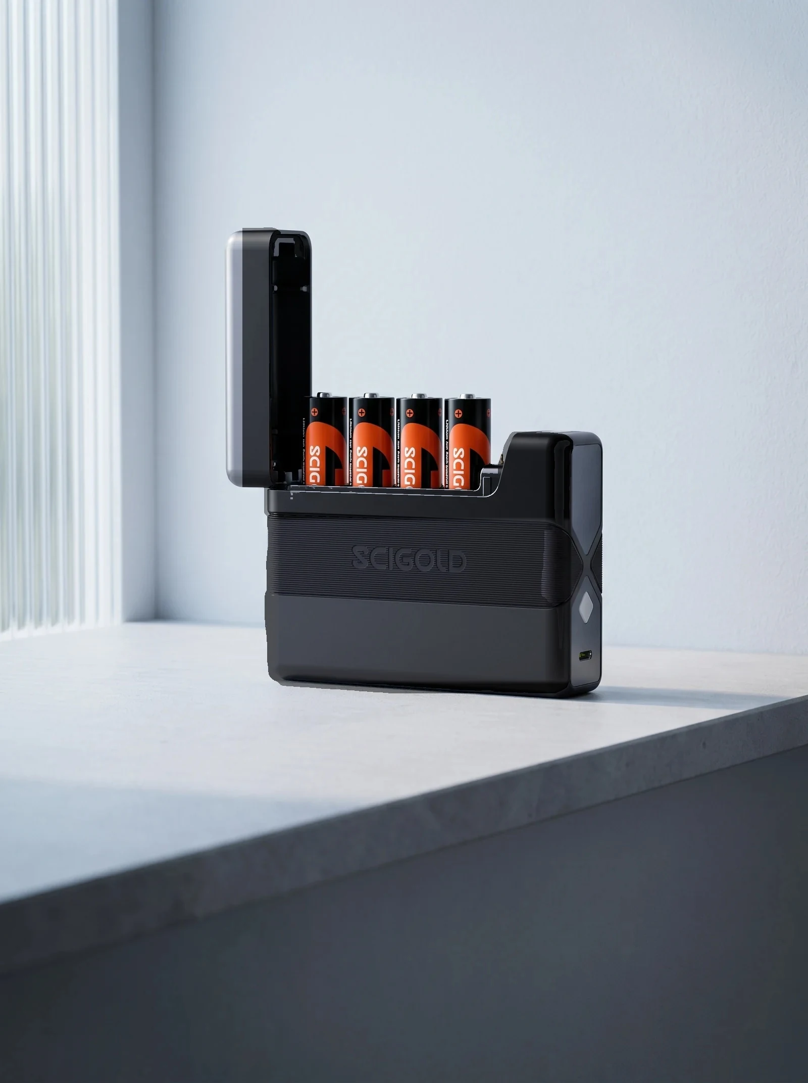 SCIGOLD Pocket Charging Case with orange-and-black AA Li-ion cells on a stone shelf