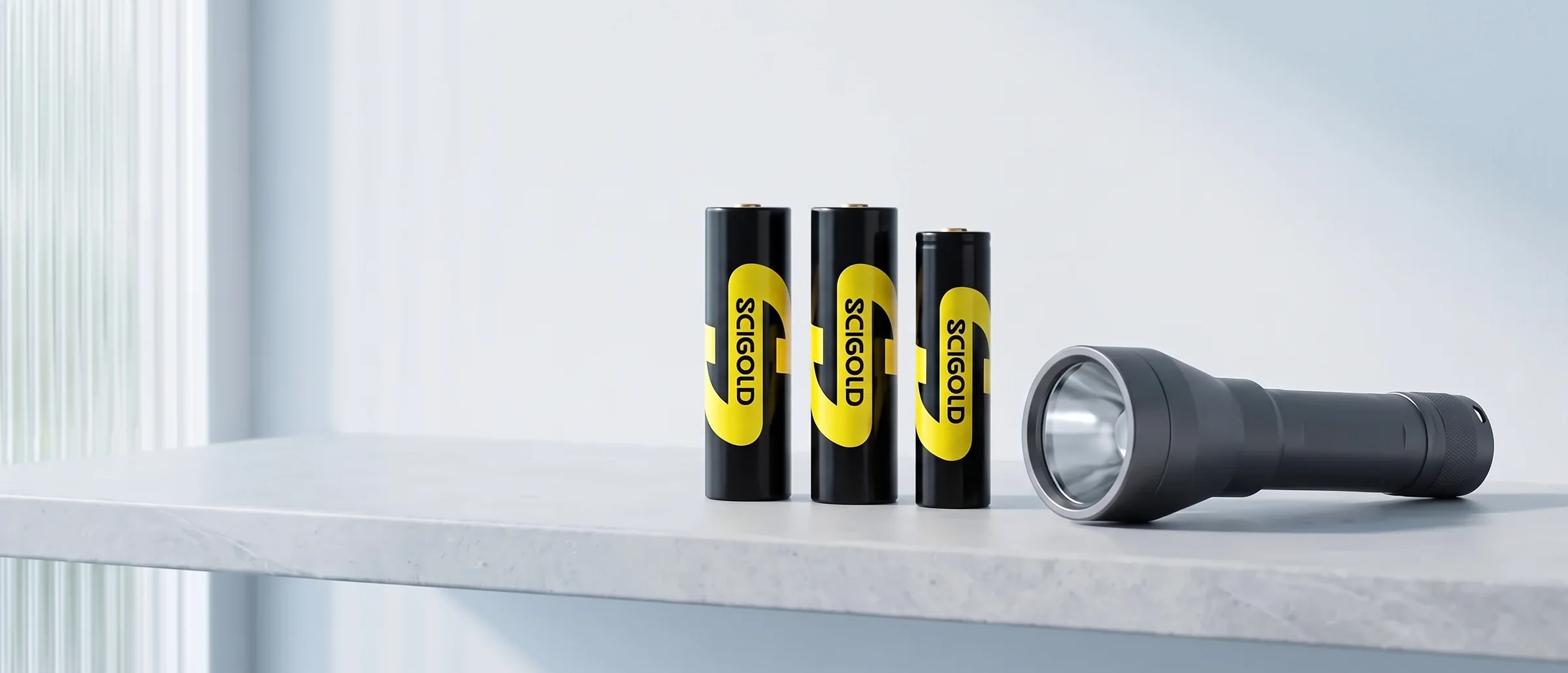 Three SCIGOLD Li-ion cells, one shorter and slimmer, and a flashlight on a stone shelf