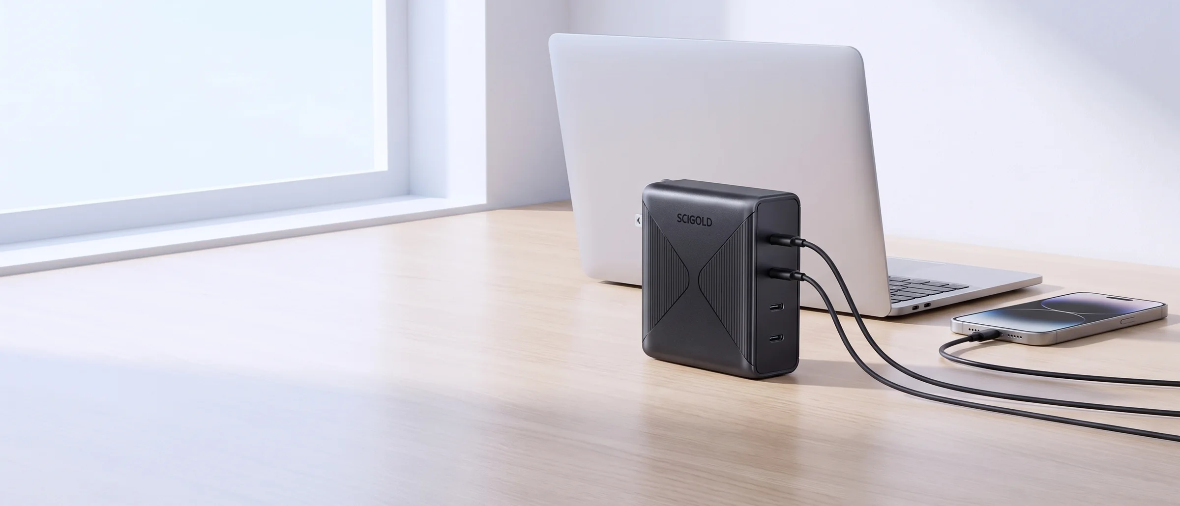 SCIGOLD 150W charger on a desk, charging a laptop and a phone